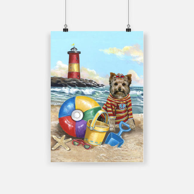 Yorkshire terrier puppy play on the beach poster 1